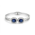 Pulsera Rígida con Dos Cristales Azules Ovalados y Circonitas - 100% Acero Bañado en Rodio